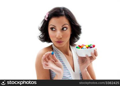 Happy beautiful candy girl looking to the side about to eat a bubblegum candy, isolated