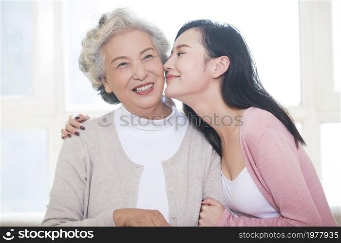 Happy beautiful mother and daughter