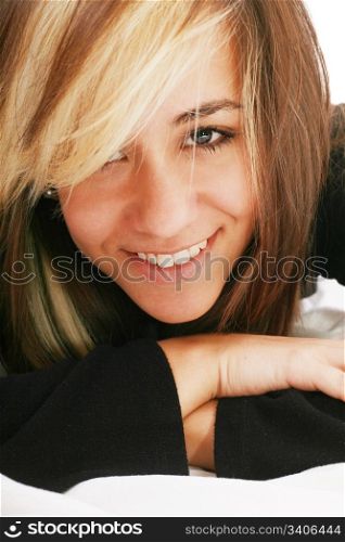 happy beautiful woman lies on a pillow in the bedroom, beautiful smiling woman