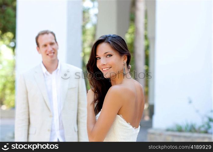 Happy beautiful woman portrait with man in blur background
