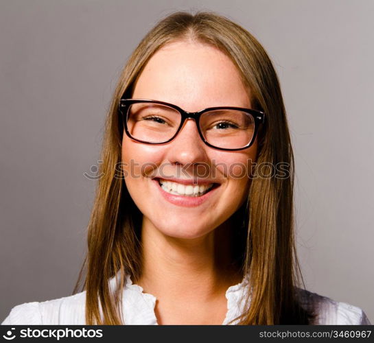 happy beautiful young caucasian woman on gray background