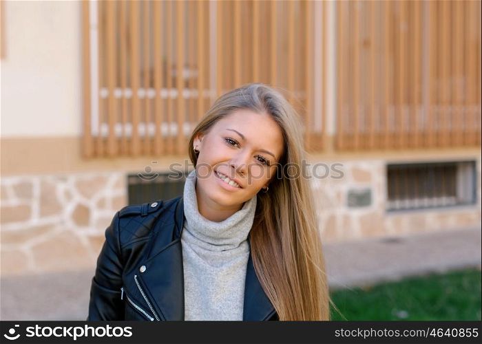 Happy beautiful young woman laughing and smiling on street
