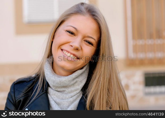 Happy beautiful young woman laughing and smiling on street