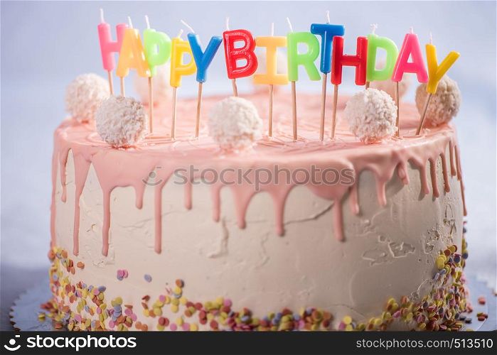 happy birthday cake with colorfull candless