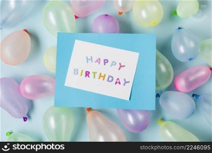 happy birthday card balloons against blue backdrop