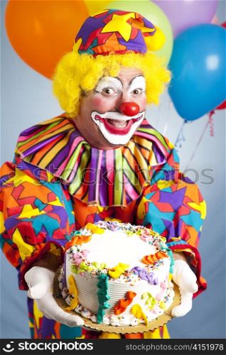 Happy birthday clown holding a birthday cake. Cake is ready for your text.