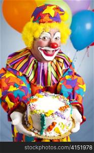Happy birthday clown holding a birthday cake. Cake is ready for your text.