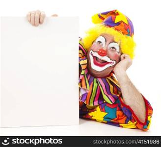 Happy birthday clown holding a sign and daydreaming. Isolated on white.