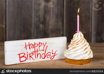 Happy birthday next to a cake to celebrate