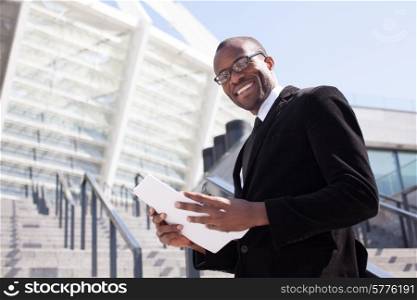 happy black businessman documents handling