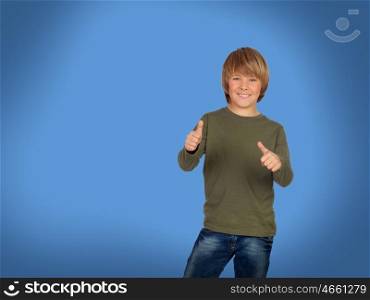 Happy blond boy saying Ok on a blue background