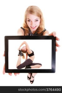 Happy blond girl showing ipad with photo of fitness fit woman doing stretching exercise. Modern young businesswoman holding tablet touchpad recommending active lifestyle. Isolated. Technology and sport.