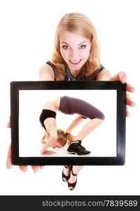 Happy blond girl showing ipad with photo of fitness fit woman doing stretching exercise. Modern young businesswoman holding tablet touchpad recommending active lifestyle. Isolated. Technology and sport.