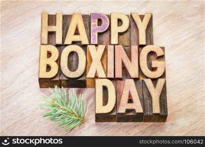 Happy Boxing Day word abstract in vintage letterpress wood type with a digital painting effect