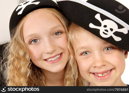 Happy Boy and Girl in in Carnival Costumes Pirates for Halloween