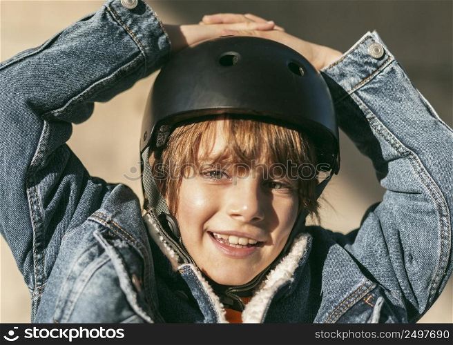 happy boy with safety helmet riding his bike