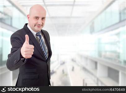 happy business man going thumb up, at the office. businessman thumb up