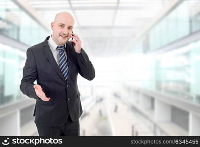 happy business man on the phone, at the office