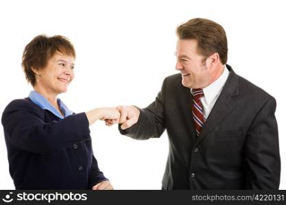 Happy business partners giving each other a fist bump. Isolated on white.