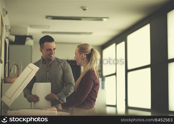 happy business people group at modern office copy documents on machine