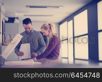 happy business people group at modern office copy documents on machine