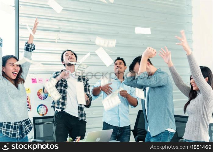 Happy business people holding dollar money and throw in the air celebrate happiness dance wealth lottery money rain drop concept. Success business cash flow corporate coworkers in company. Happy money