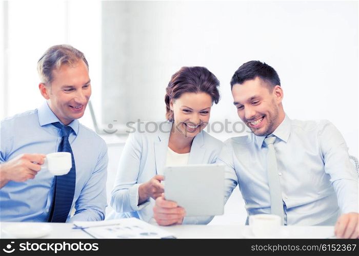 happy business team having fun with tablet pc in office. business team having fun with tablet pc in office