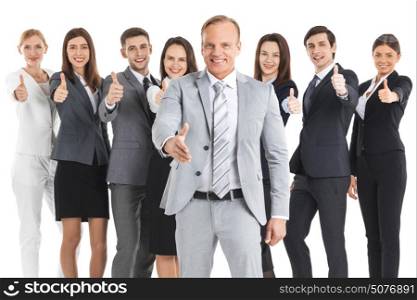 Happy business team with thumbs up. Happy business team with thumbs up isolated on white background