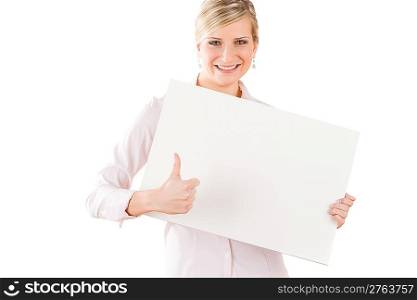 Happy business woman behind blank banner thumbs up