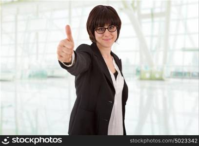 happy business woman going thumb up, at the office