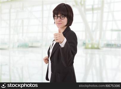happy business woman going thumb up, at the office. business woman