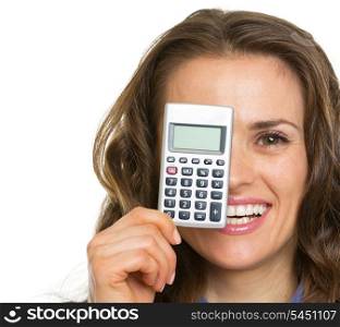 Happy business woman holding calculator in front of face