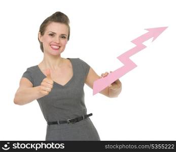 Happy business woman holding increasing chart arrow and showing thumbs up. HQ photo. Not oversharpened. Not oversaturated. Happy business woman holding increasing chart arrow and showing thumbs up isolated