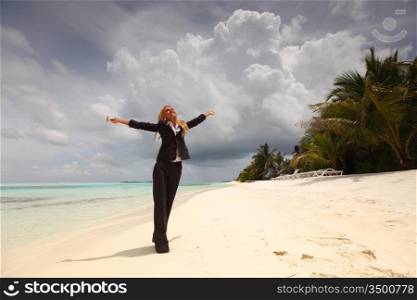 happy business woman on the desolate ocean coast