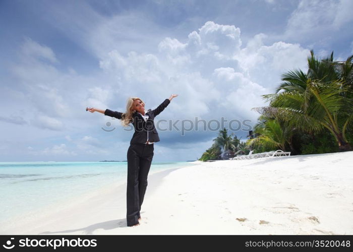 happy business woman on the desolate ocean coast