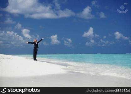 happy business woman on the desolate ocean coast