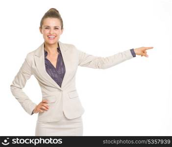 Happy business woman pointing on copy space