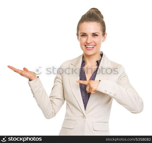 Happy business woman pointing on empty palm