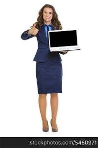 Happy business woman showing laptop blank screen and thumbs up