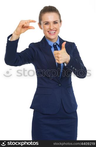 Happy business woman showing small risks gesture and thumbs up