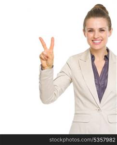 Happy business woman showing victory gesture
