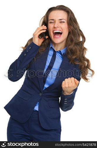 Happy business woman talking cell phone and rejoicing