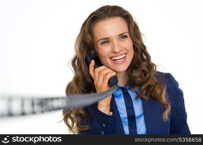 Happy business woman talking on phone