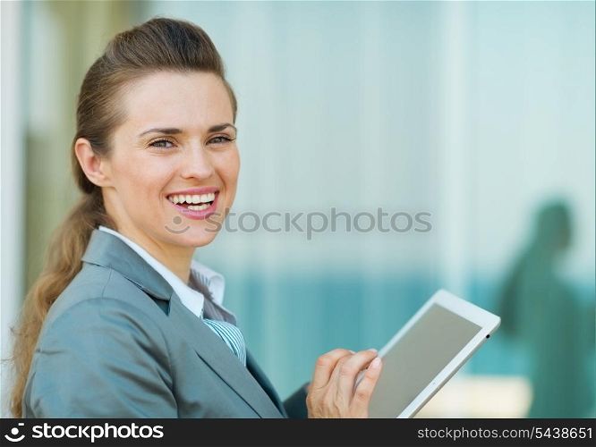 Happy business woman using in tablet PC