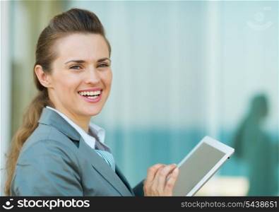 Happy business woman using in tablet PC