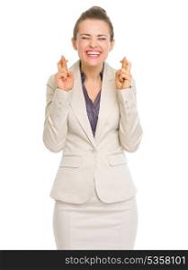Happy business woman with crossed fingers