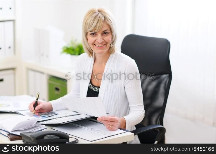 Happy business woman working at office