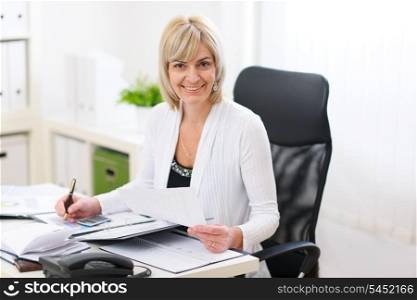 Happy business woman working at office