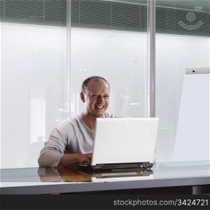 happy businessman in the office who working on the notebook
