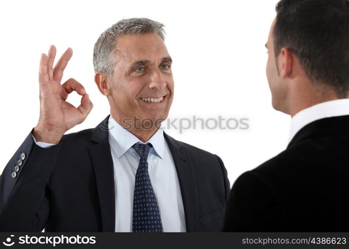 happy businessman making an okay sign